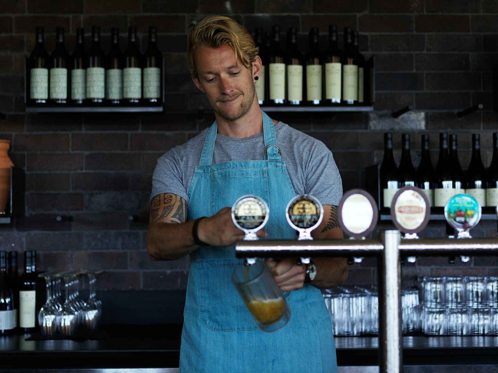 waiter pouring beer